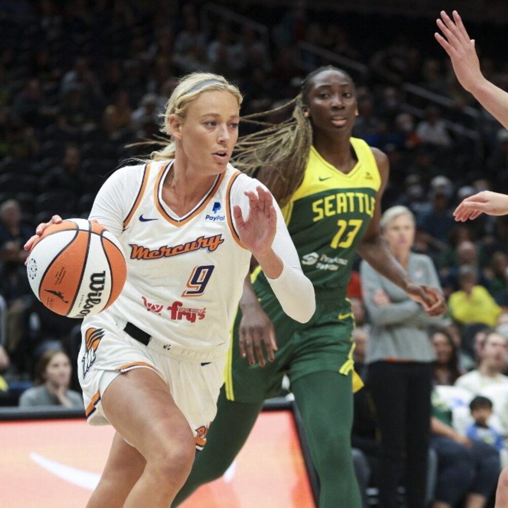 A pointing finger turns a WNBA basketball model into a meme